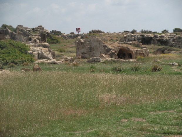 Tomb of the Kings, an ancient burial site in Paphos - with KFC sign in background